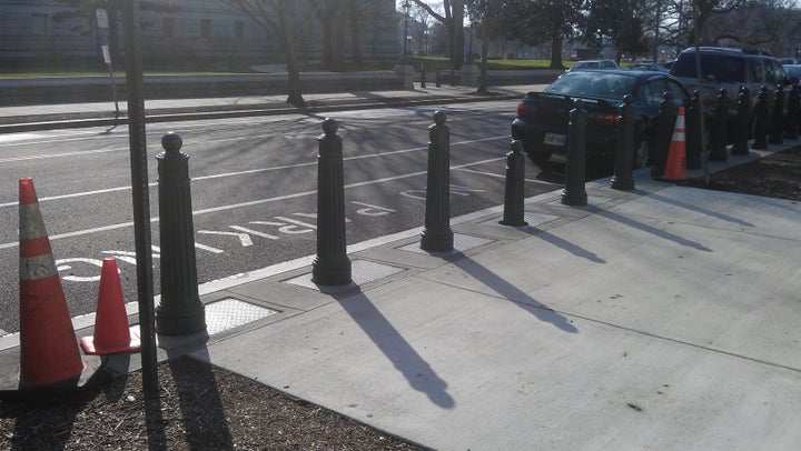 <p>DC has the coolest stuff. These columns retract. Once I was walking by and the barriers started moving! I jumped back like I had seen a ghost.The columns retract so vehicles can enter. Who knew?</p>
