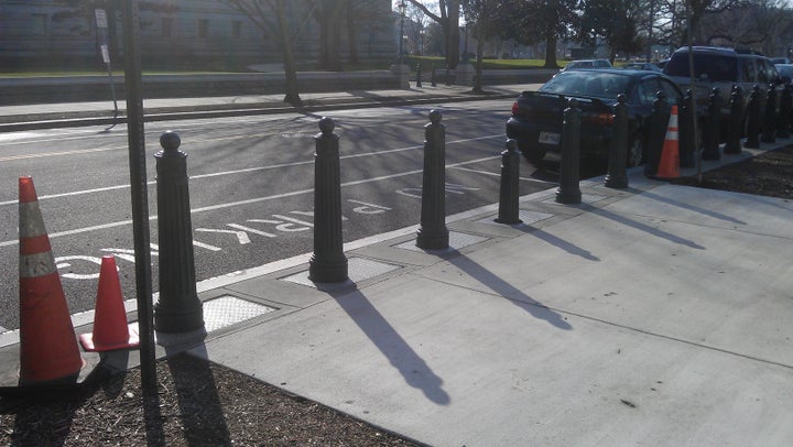 DC has the coolest stuff. These columns retract. Once I was walking by and the barriers started moving! I jumped back like I had seen a ghost.The columns retract so vehicles can enter. Who knew?