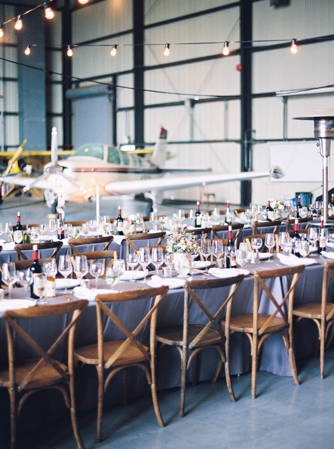 Airplane hanger wedding, Livermore, California. Captured by Kristine Herman Photography