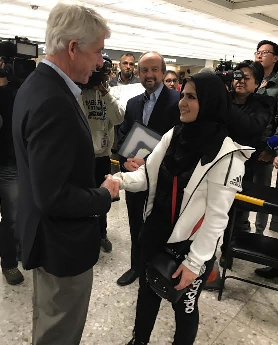 Virginia Attorney General Mark Herring welcomes George Mason University student Najwa Elyazgi, 23, upon her return to the U.S