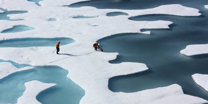 A crew from the US Coast Guard retrieves supplies during a mission to study the effects of climate change on the region.