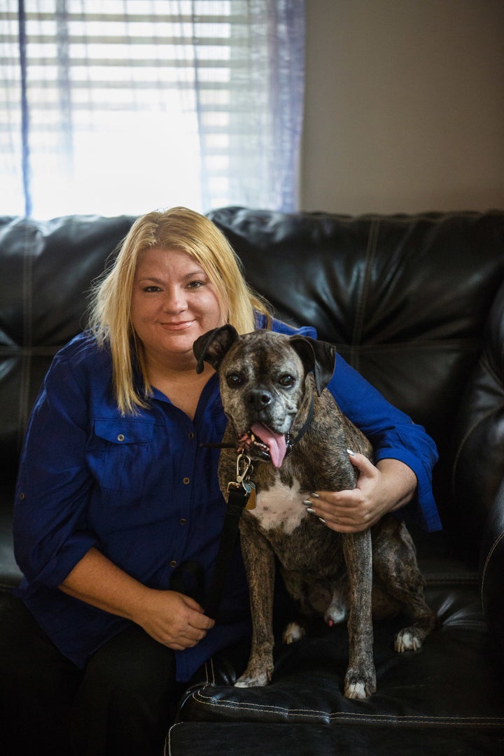 Rosie Palfy, Marine veteran and homeless advocate, with her Boxer, Bubba (RIP), at home in Parma, Ohio. Photo by Scott Shaw.