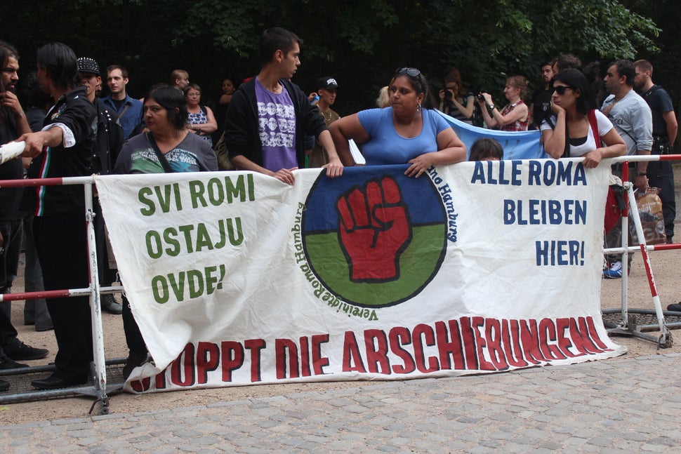 Roma migrants in&nbsp;Germany carry a sign that reads "ALL ROMA STAY HERE!" and&nbsp;"STOP THE DEPORTATIONS!" during a protes