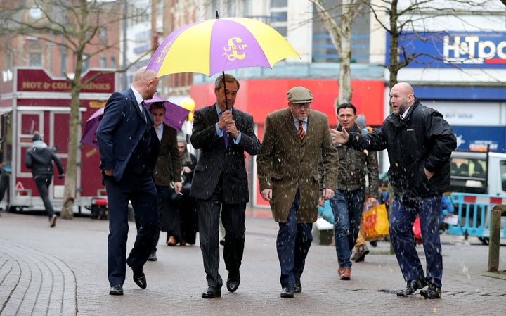 Paul Nuttall and former Ukip leader Nigel Farage dodge an egg thrown at them while campaigning in Stoke