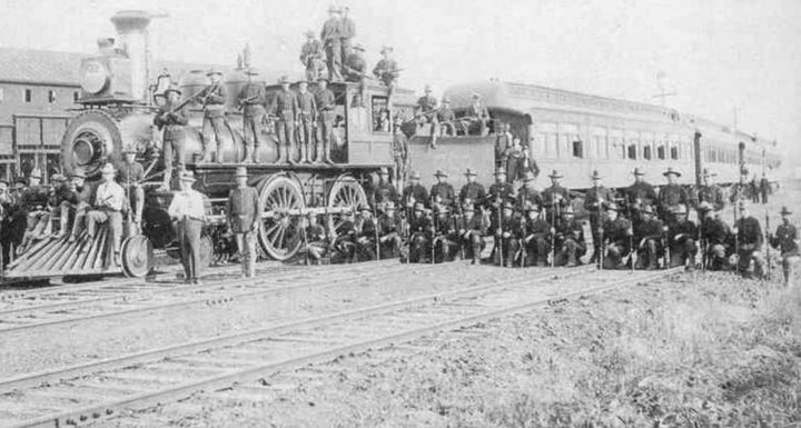 Federal troops guard a train near the Pullman factory