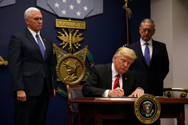 Trump signs an executive order he said would impose tighter vetting to prevent foreign terrorists from entering the United States, Jan. 27, 2017.