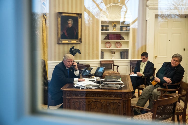 President Donald Trump speaks on the phone with Australian Prime Minister Malcolm Turnbull on Jan. 28, 2017, with national security adviser Mike Flynn, center, and Chief Strategist Steve Bannon, at right.