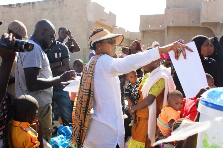 Staff members of the NGO HelpGambia coordinate transfers of Gambian refugees in Karang, Senegal.