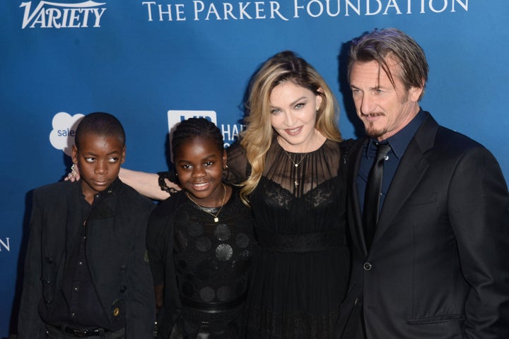 Madonna and Sean Penn pose with the singer's children, David Banda and Mercy James, at the 5th Annual Sean Penn & Friends Help Haiti Home Gala on Jan. 9, 2016.