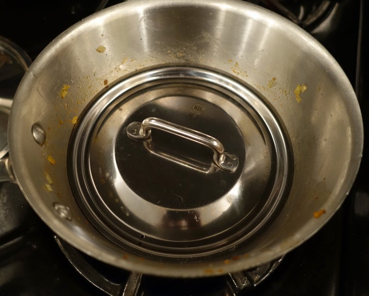 <p>The pan was larger than needed for the rice, so a smaller lid created a cozier cooking space</p>