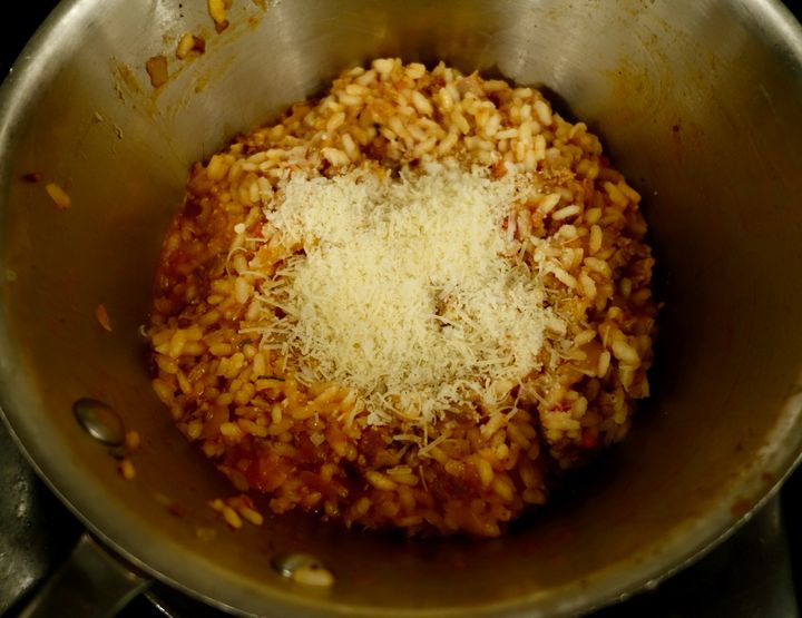 Sausage mixture combined with the rice and re-heated; parmesan about to be stirred in