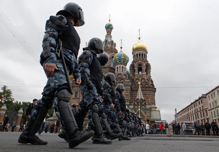 Riot police walk in line during the "March of Millions" protest rally, held by opposition supporters, in St. Petersburg, Sept