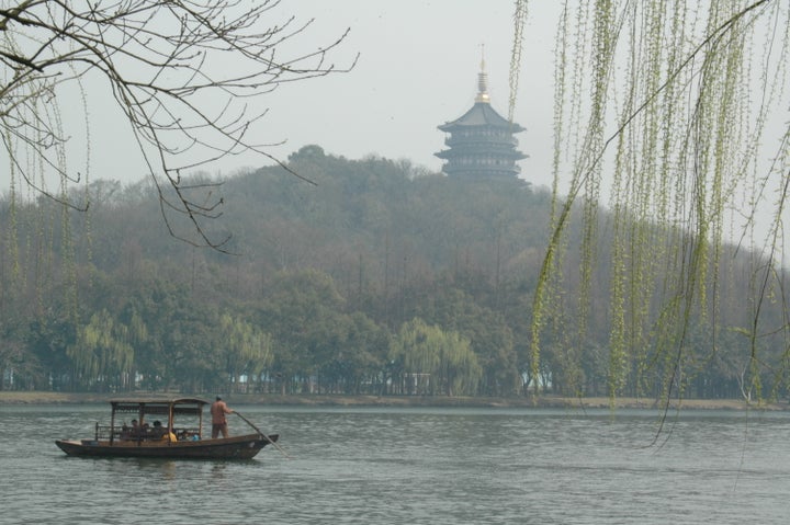 <p><em>The tranquil </em> <em>scene on West Lake </em> </p>