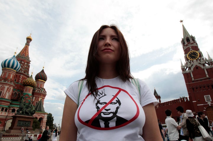 An opposition supporter defends the right of assembly in Red Square, as part of a campaign protesting against Vladimir Putin'