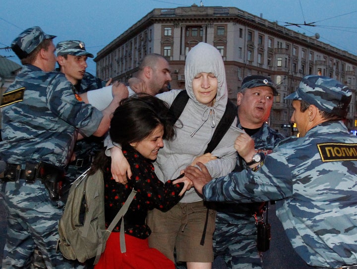 Members of the Russian Interior Ministry detain opposition activists demonstrating against Russian President Vladimir Putin's presidency, May 16, 2012.