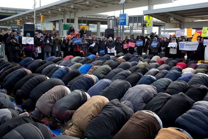 The New York Immigrant Coalition protests President Trump's executive order to ban immigration from seven Muslim countries by holding Jummah, the muslim Friday prayer, in the parking lot of Terminal 4 at JFK International Airport on February 3, 2017.