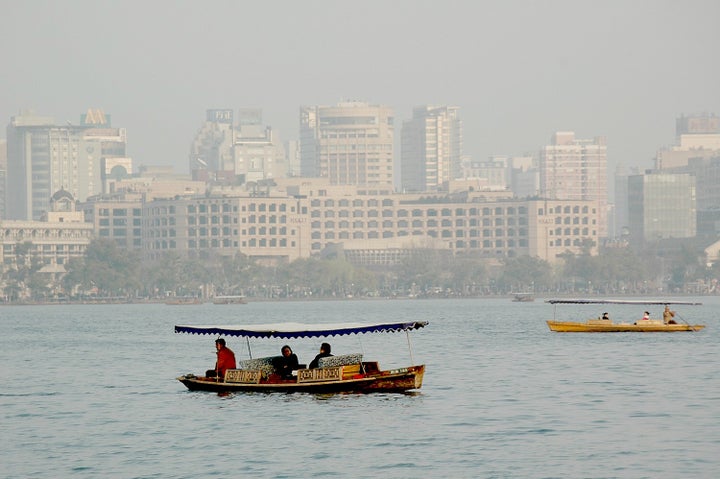 <p><em>Traditional wooden boats on West Lake against the backdrop of Hangzhou, China’s modern skyline </em> </p>