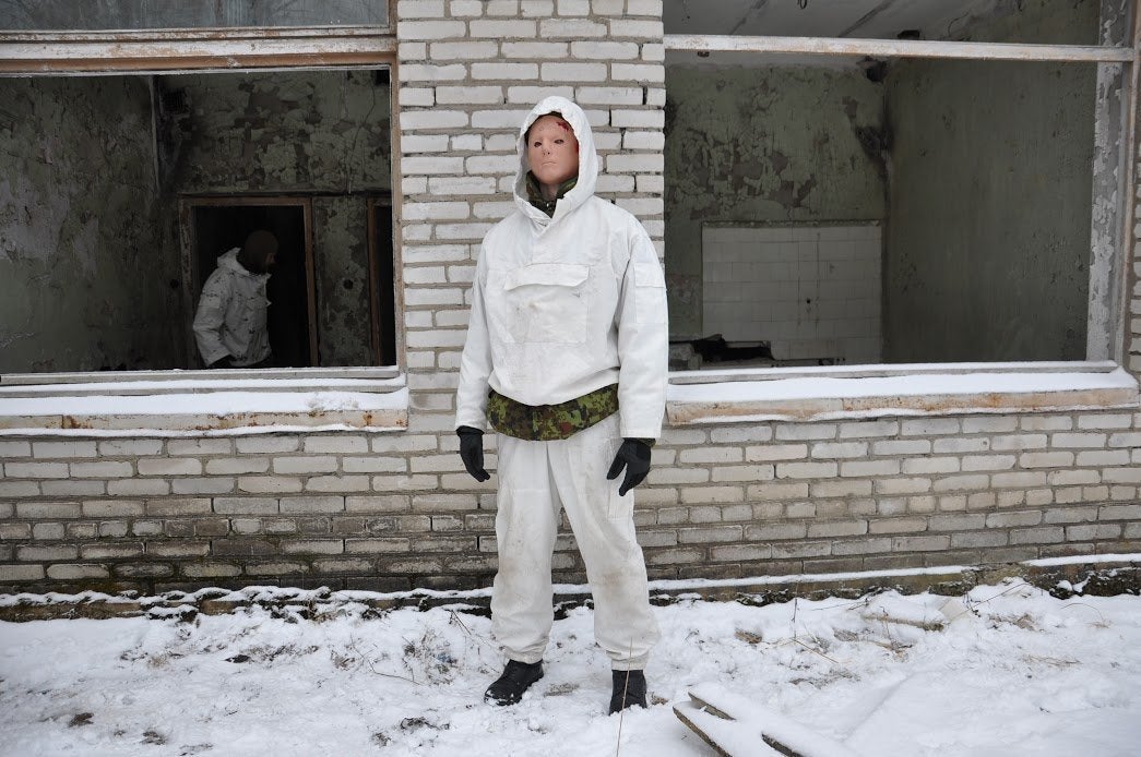 A participant in the Utria Assault dressed to look like a victim of an improvised explosive device prepares to take part in a test of first aid skills. Jan. 13.