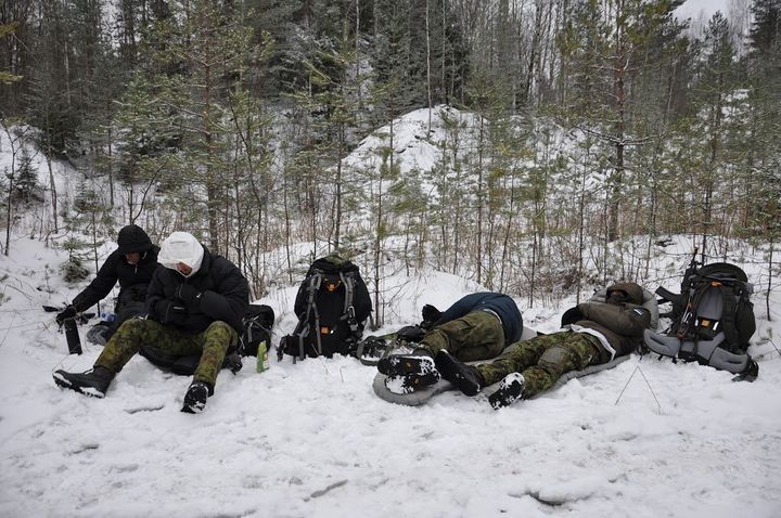 Participants in the Utria Assault rest in a forest near Estonia's border with Russia. Jan. 13.