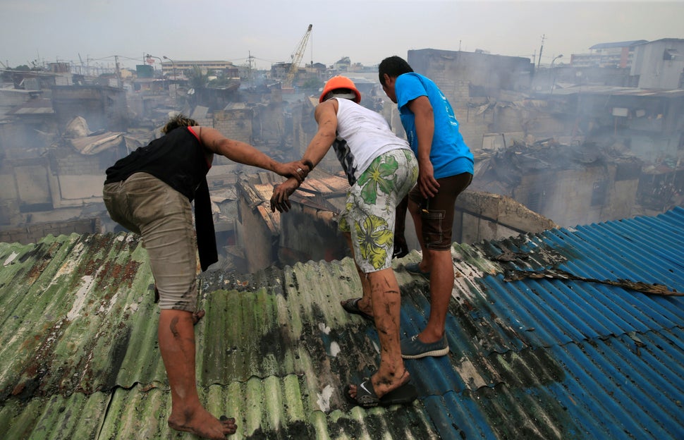 Residents survey the dire damage.<i></i>