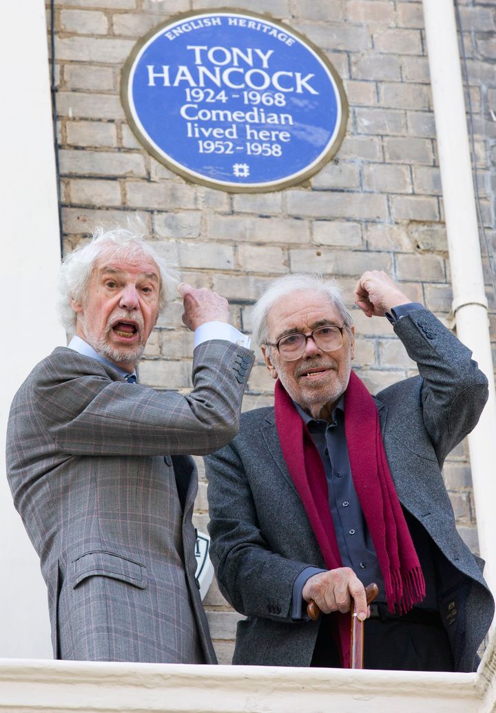 Galton and Simpson outside Tony Hancock's London home, now marked with a blue plaque