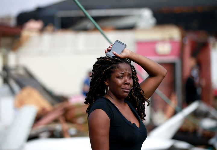 A woman looks at the wreckage caused by a tornado that touched down along Chef Menteur Avenue on Tuesday in New Orleans.