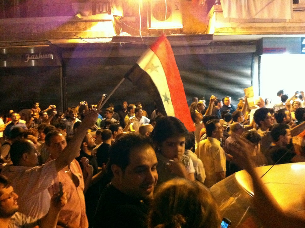 Protesters take part in a demonstration against Syrian President Bashar Assad in Aleppo on June 30, 2011.