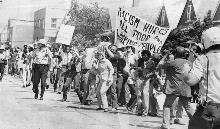 Anti-racism demonstrators line the streets as they protest a potential neo-Nazi march, Skokie, Illinois, 1977.