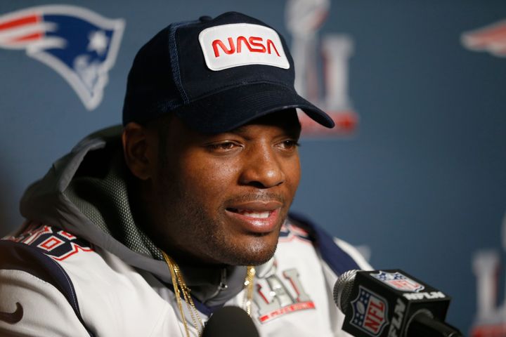 Martellus Bennett sports a NASA hat while speaking to the media on Feb. 1 ahead of Super Bowl LI.