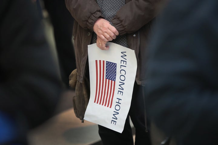 A supporter waits at O'Hare Airport for Syrian refugee Baraa Haj Khalaf and her family to arrive on a flight from Istanbul, Turkey at O'Hare Airport on February 7, 2017 in Chicago, Illinois.