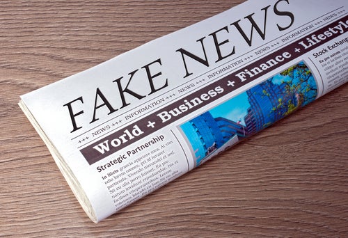<p>Fake News Newspaper on desk in the office</p>