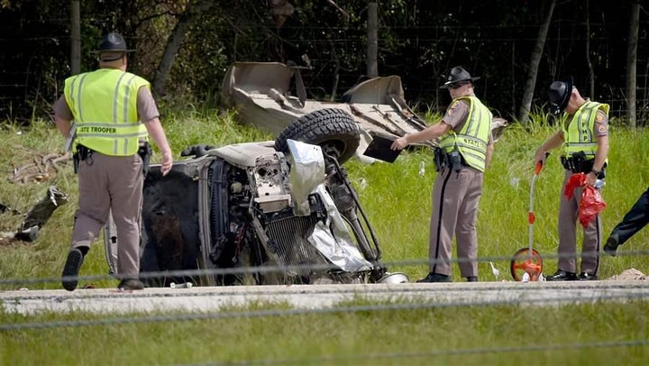 Florida Highway Patrol troopers investigate the scene of a deadly crash involving several vehicles in Lakeland, Florida, in J