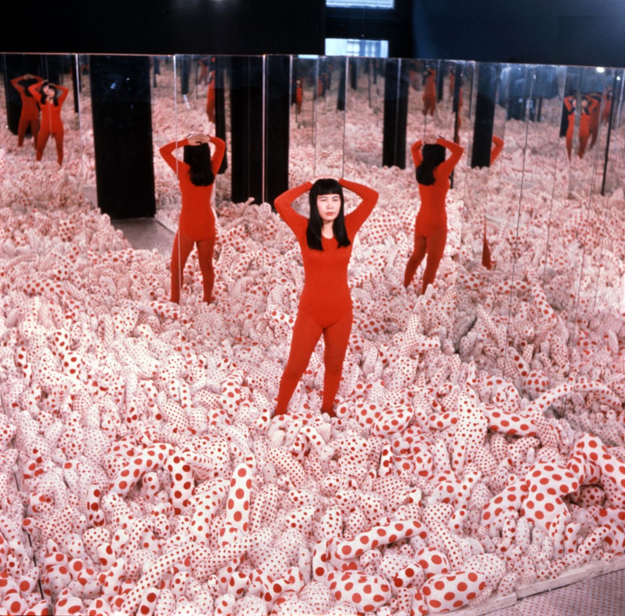 Yayoi Kusama, again, posing in "Infinity Mirror Room—Phalli’s Field," 1965.