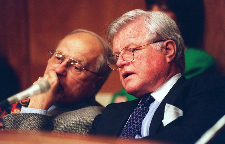 Dingell and then-Sen. Edward Kennedy (D-Mass.), seen here during a 1997 hearing on managed care reform. The two worked for years to advance universal health care.