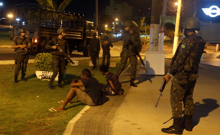 Army officers detain two men in Vitoria. 