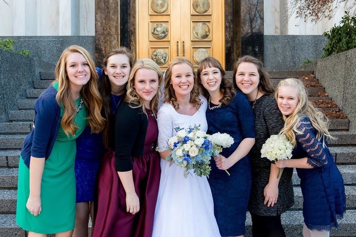 Janessa, standing to the left of bride Amy.