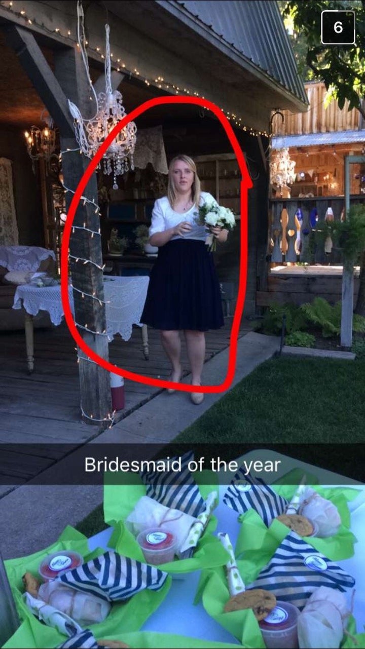 Janessa at another friend's wedding being an all-star bridesmaid by putting together a bouquet for the bouquet toss. 