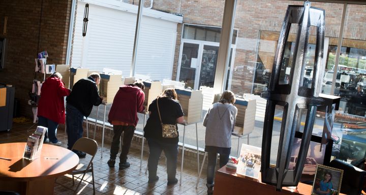 Voters cast their ballots at the Donnell Ford car dealership on November 8, 2016 in Salem, Ohio.