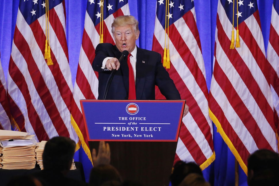 Then-U.S. President-elect Donald Trump calls CNN "fake news" after an argument with the outlet's reporter during a press 