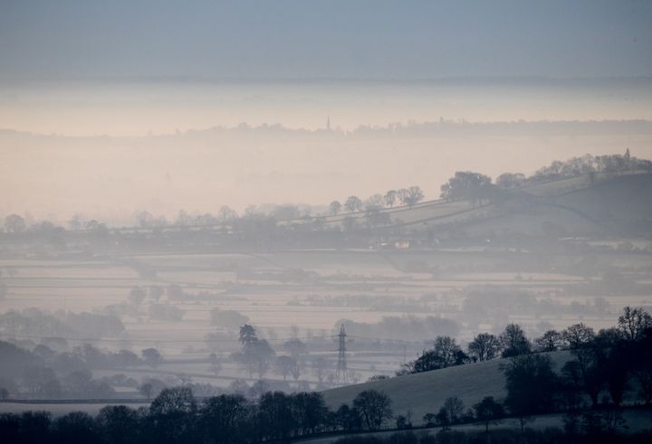Mist and fog lingers in frost covered fields surrounding Glastonbury on 6 February
