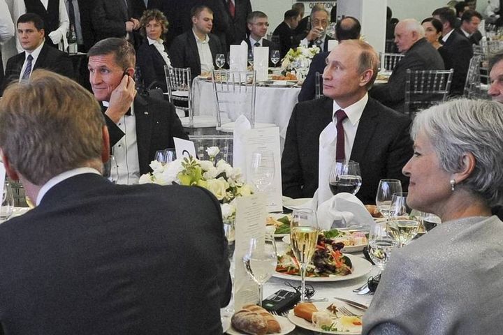 <p>Trump’s national security adviser, Michael Flynn, at an RT party with Russian president Vladimir Putin.</p>