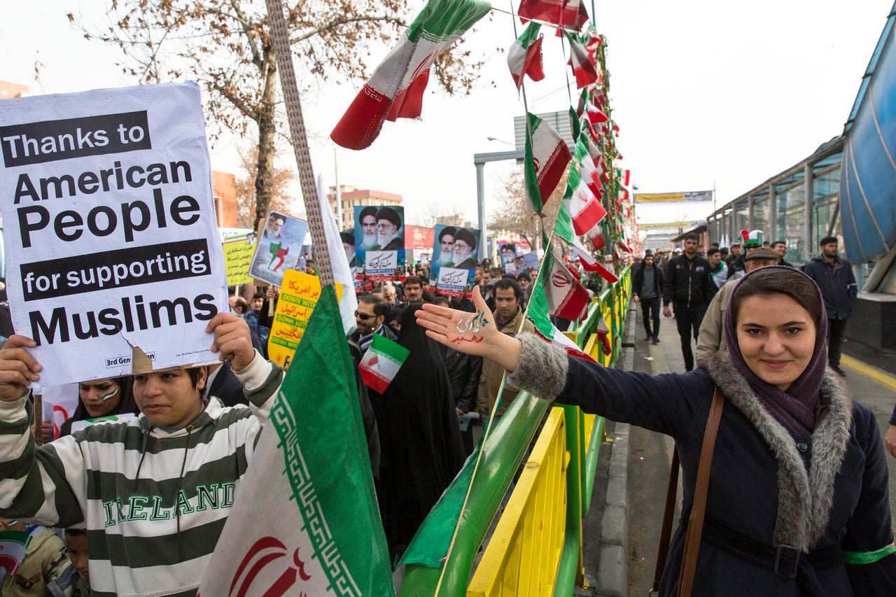 Iranians in Tehran celebrate the anniversary of the 1979 Islamic Revolution by thanking Americans for protesting Trump's travel ban on Feb. 10.