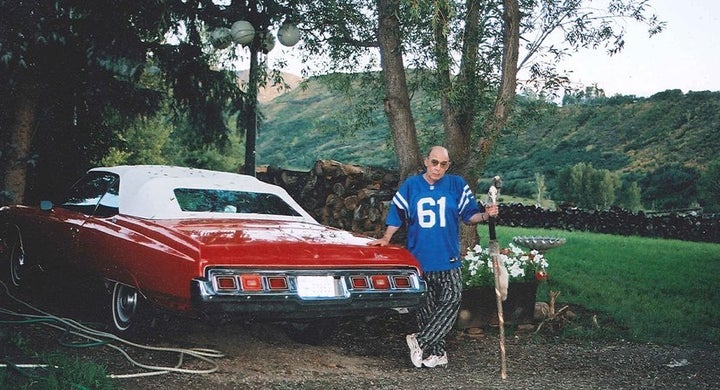 Hunter Thompson in his Colts jersey with the Red Shark at Owl Farm, 2003