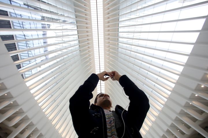 An unidentified man takes a photo in the World Trade Center Oculus transit hub.