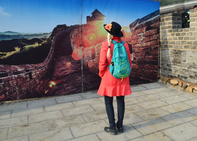 Looking at a mural near the entrance, waiting for it to open.
