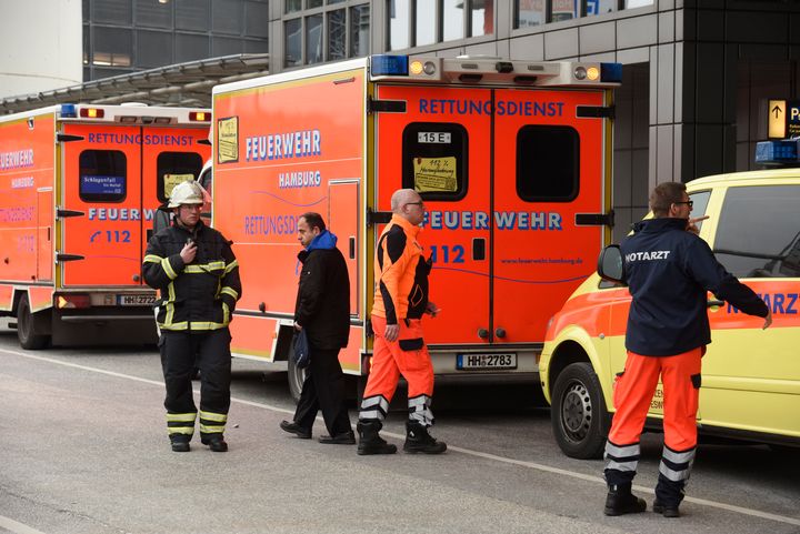 Firemen and paramedics are seen outside the Helmut Schmidt airport in Hamburg