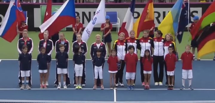 Members of Germany's tennis team, as well as fans, appeared to try to sing over the outdated verse with their country's modern anthem.