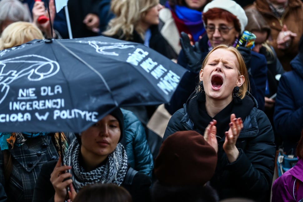 Hundreds of women with umbrellas participate in a nationwide women's strike on Oct. 24, 2016 in the city center of Warsaw, Po