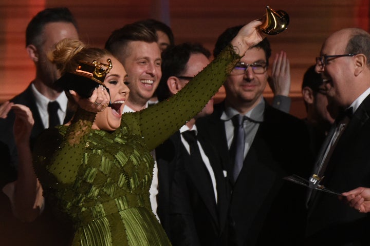 Adele's all laughs as she breaks her Grammy.