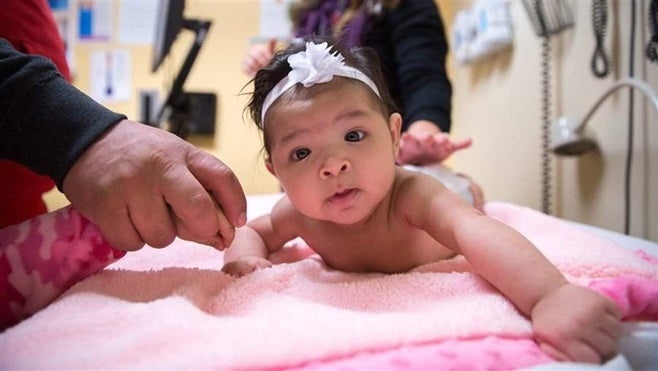 <p>Four-month-old Evelyn Palomares Zavala receives a well-baby check Feb. 1 at the CommuniCare Salud Clinic in West Sacramento, Calif. Over half of babies born in California are Latino.</p>